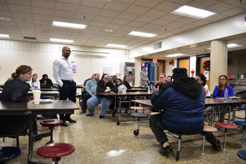 Cohesion Network - instructor standing n a classroom