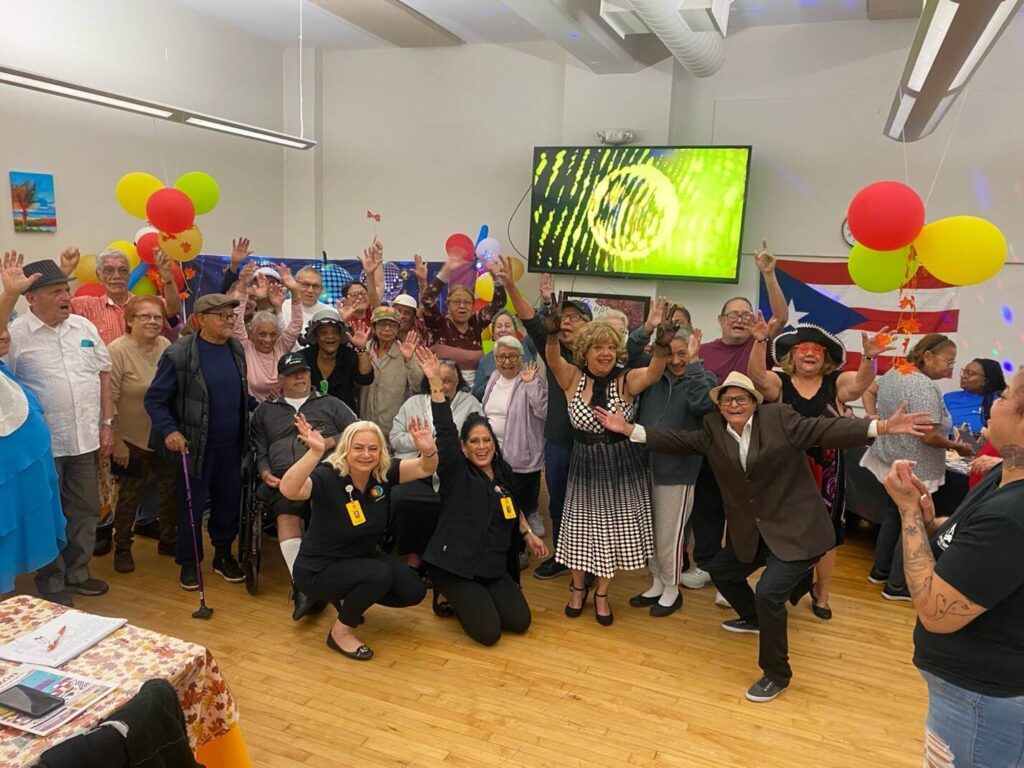 Group of guests posing at the Motown Memories event at the Hispanic Center in Bethlehem