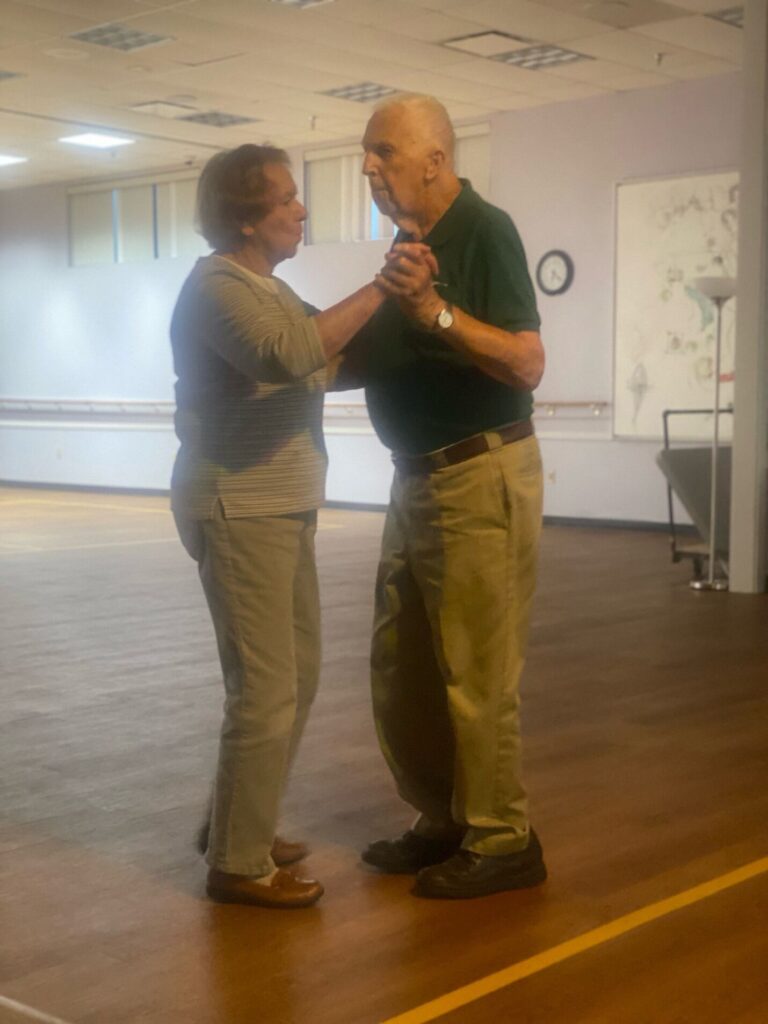 Elderly couple dancing together in a large room at Lehigh Valley Active Life