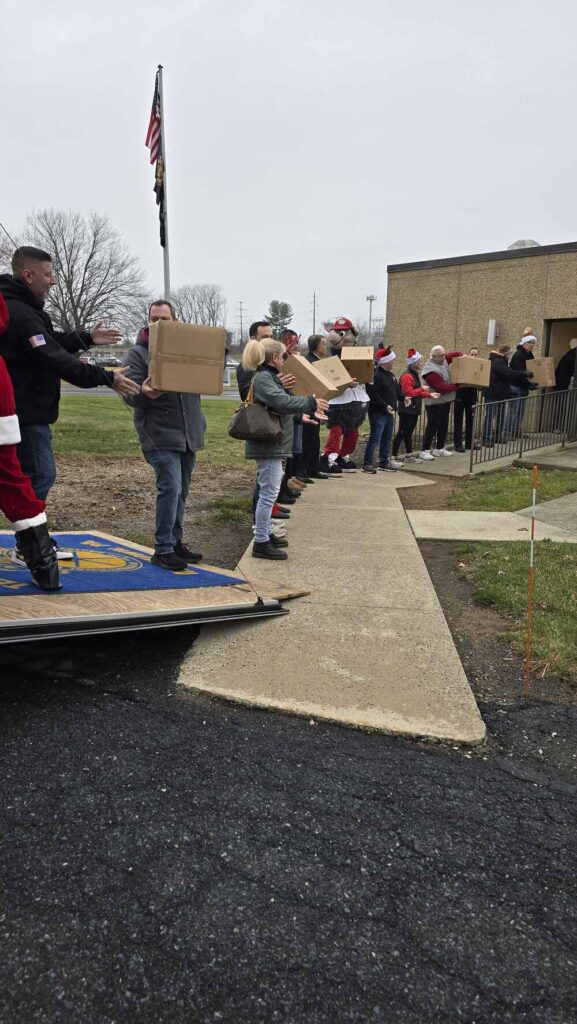 Volunteers in Allentown packing presents during the 2024 TeenWorks Toy Drive