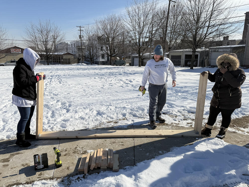 Americorp Vistas build garden beds at Ramos Elementary School for MLK Day