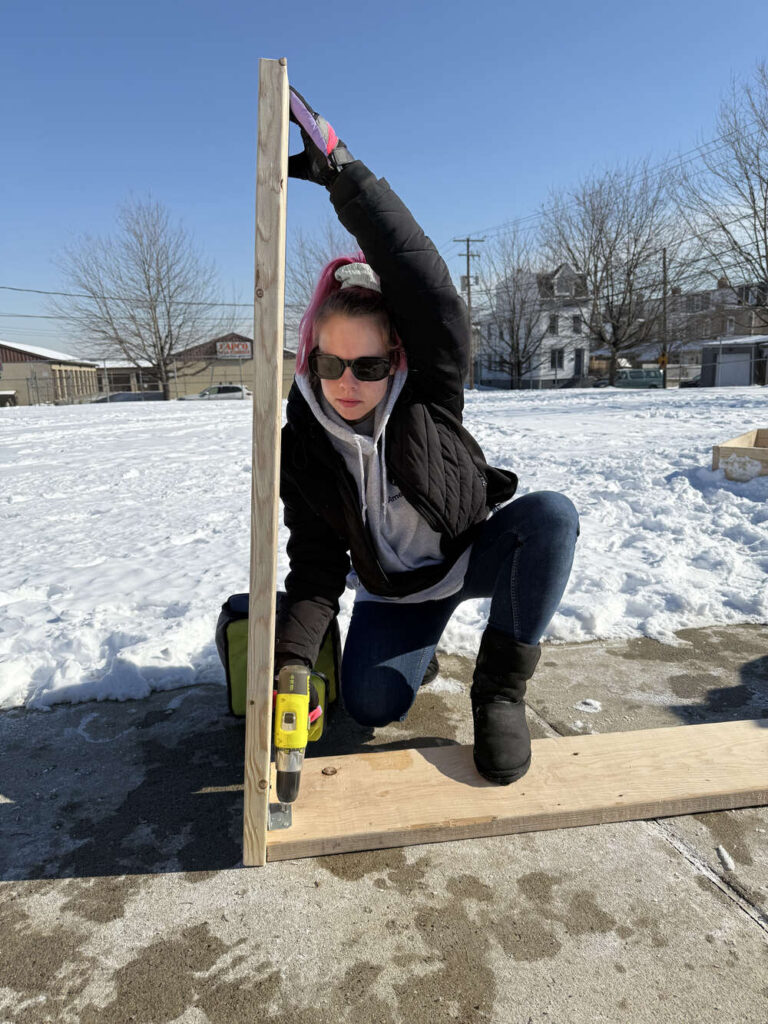 Americorp Vistas build garden beds at Ramos Elementary School for MLK Day