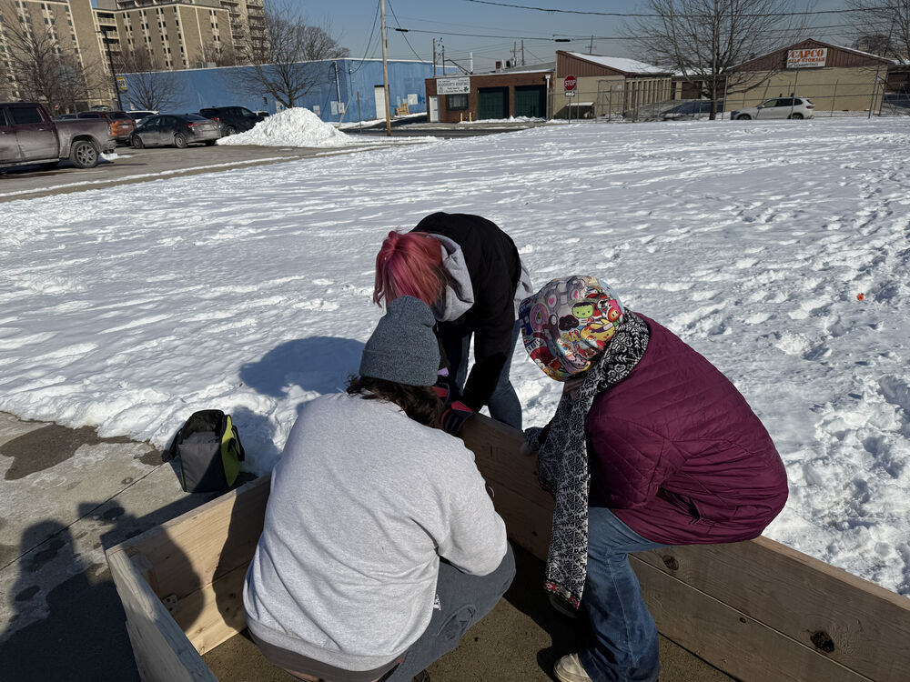 Americorp Vistas build garden beds at Ramos Elementary School for MLK Day