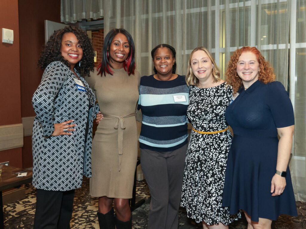 United Way's Erin Connelly with 4 attendees at the Women United annual meeting at the Renaissance Allentown Hotel